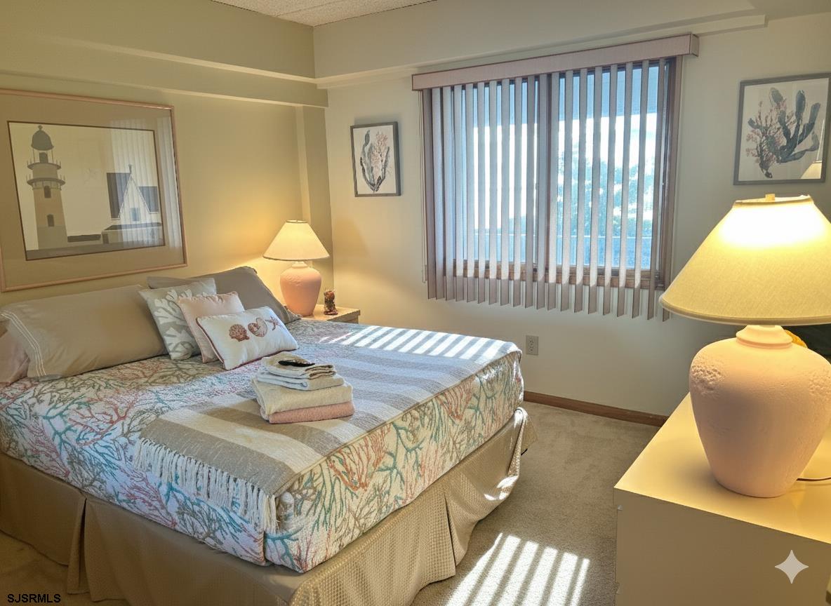 400 West Brigantine Avenue, Unit 2 Brigantine, NJ 08203 - Photo 3 of 24 a bedroom with a bed and window
