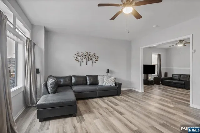 a living room with furniture and a window