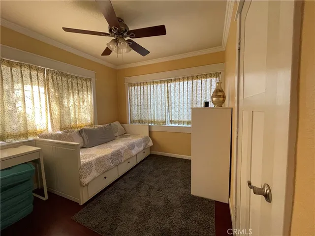 a bed room with a bed and a window