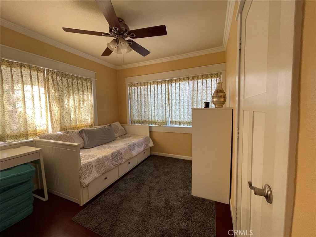 113 East 11th Street Redlands, CA 92374 - Photo 12 of 18 a bed room with a bed and a window