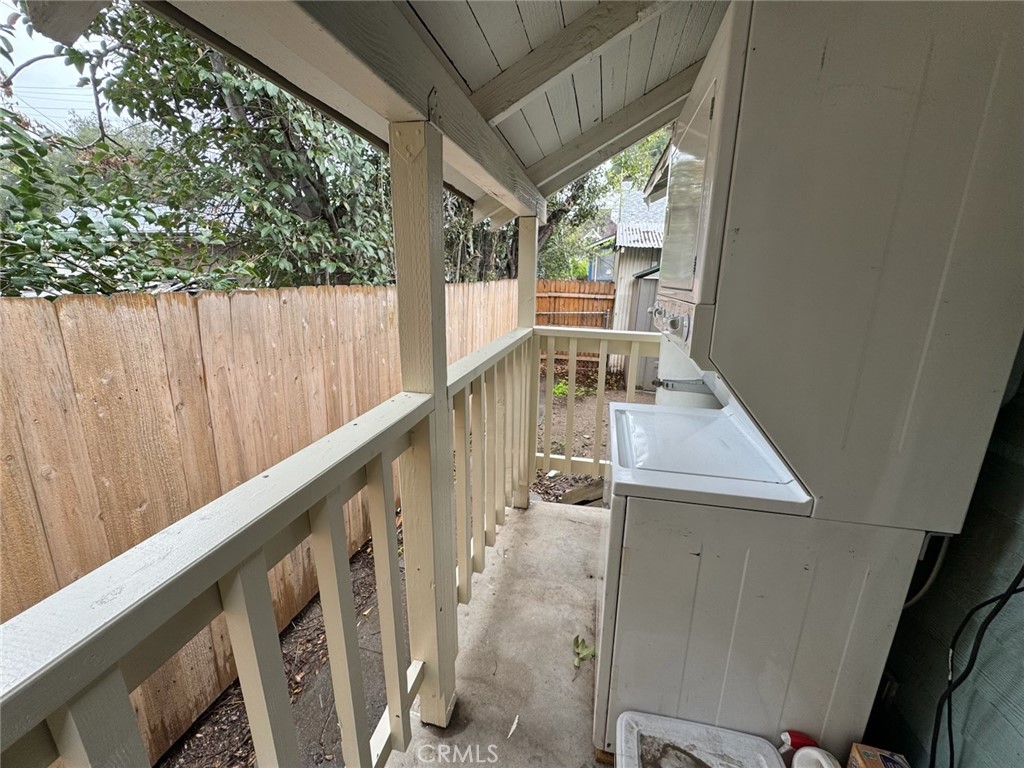 113 East 11th Street Redlands, CA 92374 - Photo 16 of 18 a view of balcony with wooden floor and fence