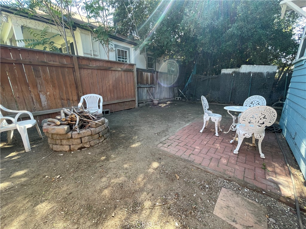 113 East 11th Street Redlands, CA 92374 - Photo 18 of 18 a view of a chair and table in backyard