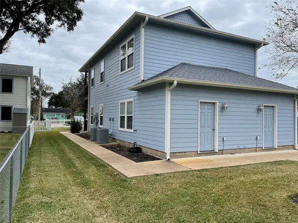 a view of a house with swimming pool and sitting area