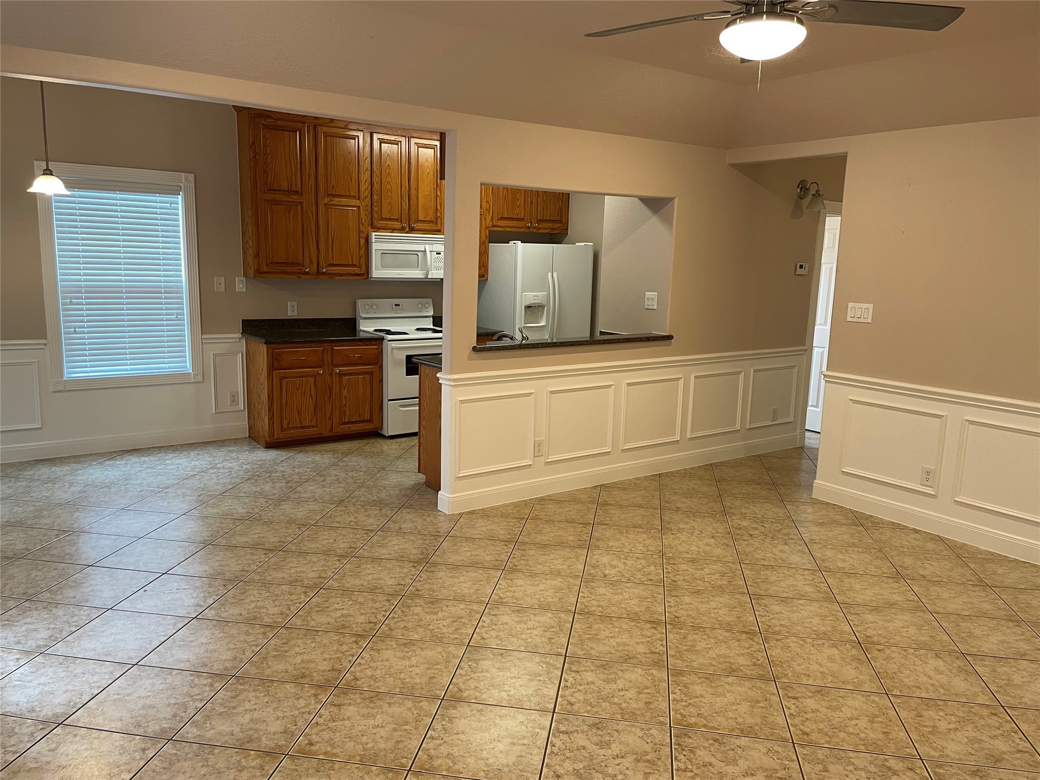 1018 South Booth Lane Alvin, TX 77511 - Photo 3 of 19 a kitchen with a sink a stove and cabinets