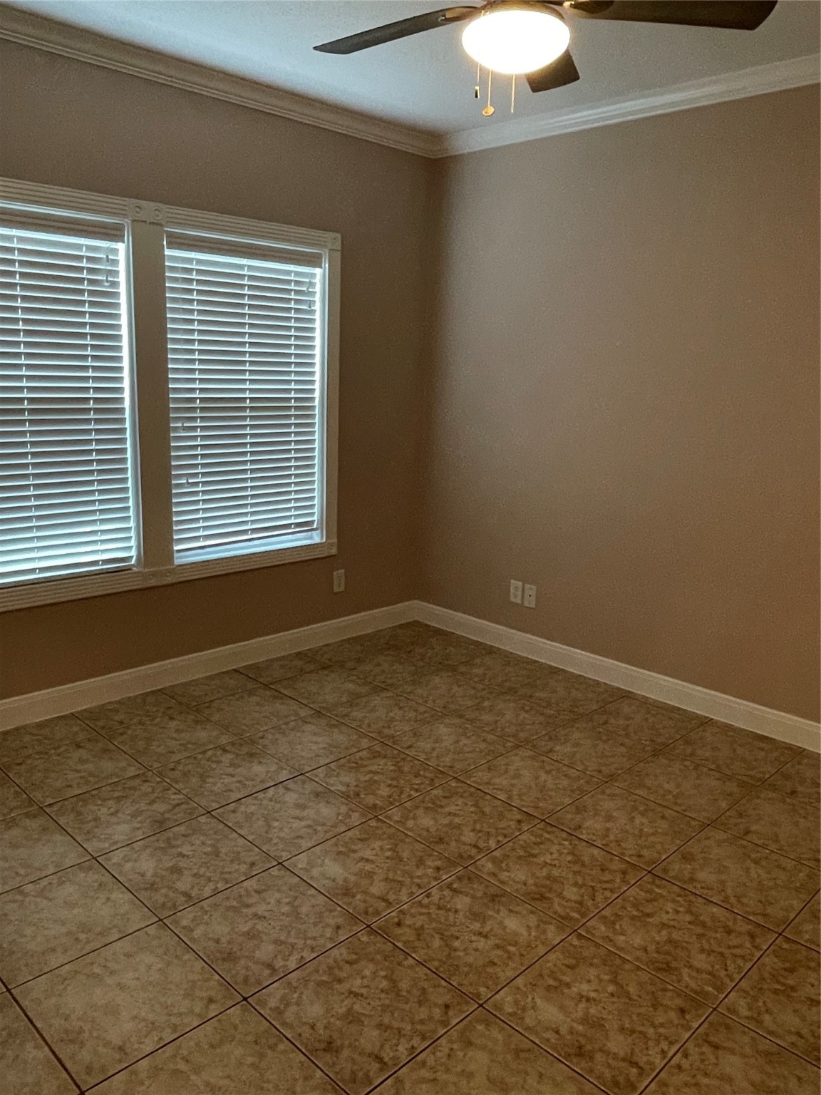1018 South Booth Lane Alvin, TX 77511 - Photo 10 of 19 a view of an empty room with a window