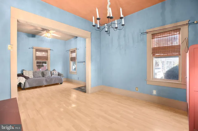 a view of a bedroom with a large bed and dresser