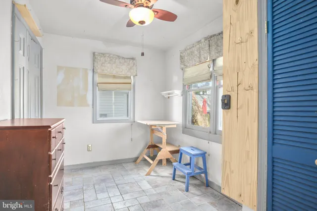 a view of an empty room with a window