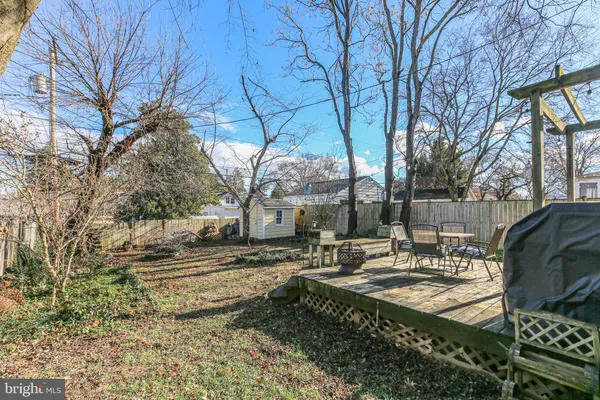 a view of a patio with a table and chairs
