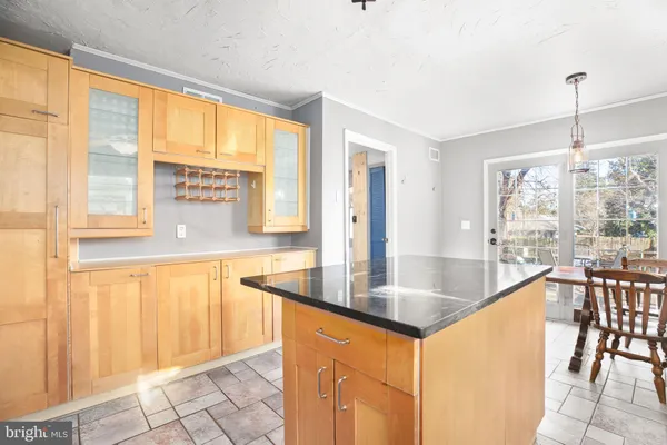 a very nice looking kitchen with a large window
