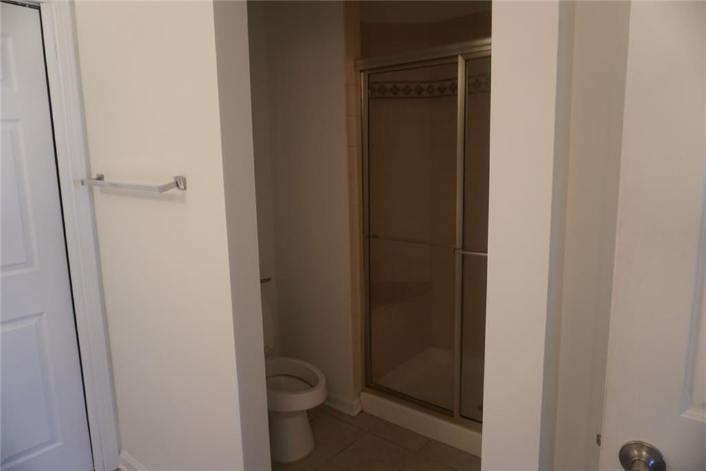 1802 Cascade Park Drive Southwest Atlanta, GA 30331 - Photo 12 of 21 a bathroom with a granite countertop toilet and a sink