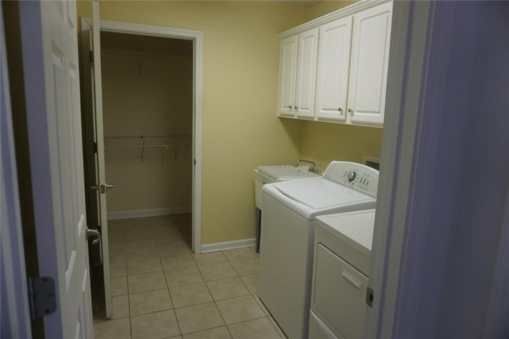 1802 Cascade Park Drive Southwest Atlanta, GA 30331 - Photo 19 of 21 a utility room with dryer and washer