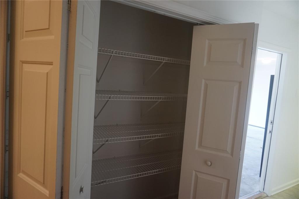 1802 Cascade Park Drive Southwest Atlanta, GA 30331 - Photo 20 of 21 a view of walk in closet with empty racks