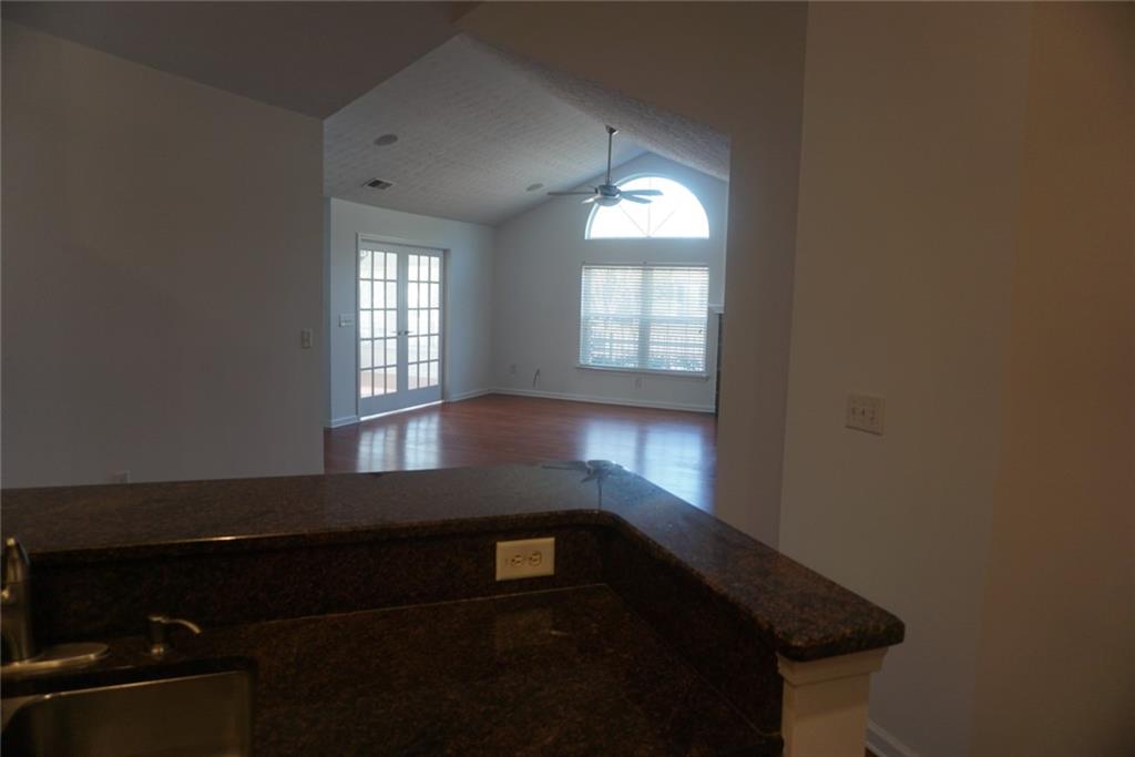 1802 Cascade Park Drive Southwest Atlanta, GA 30331 - Photo 5 of 21 wooden floor in an empty room with a window