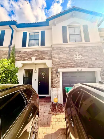 a view of parking house with car parked