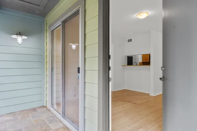 a view of a bathroom from a hallway