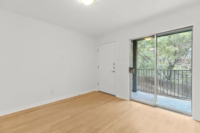 a view of empty room with sliding door