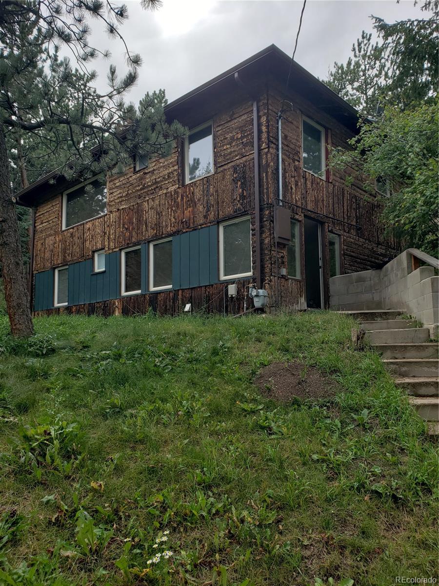 11769 Ranch Elsie Road Golden, CO 80403 - Photo 1 of 39 a view of a house with a yard