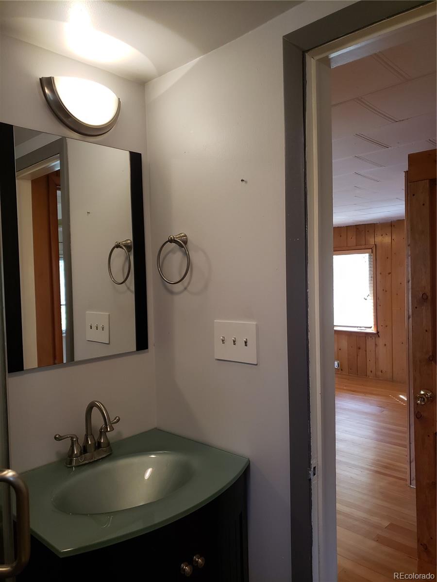 11769 Ranch Elsie Road Golden, CO 80403 - Photo 25 of 39 a bathroom with a sink and a mirror