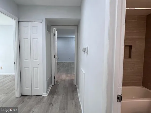 a bathroom with a tub and shower