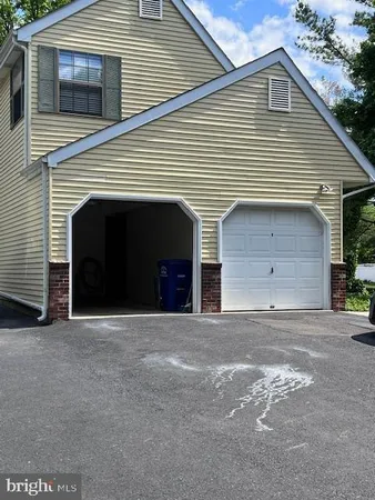 a front view of a house with a garage