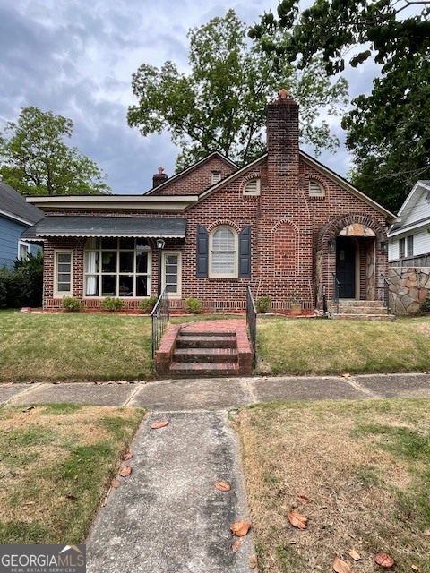 311 3rd Street Manchester, GA 31816 - Photo 1 of 61 a front view of a house with a yard