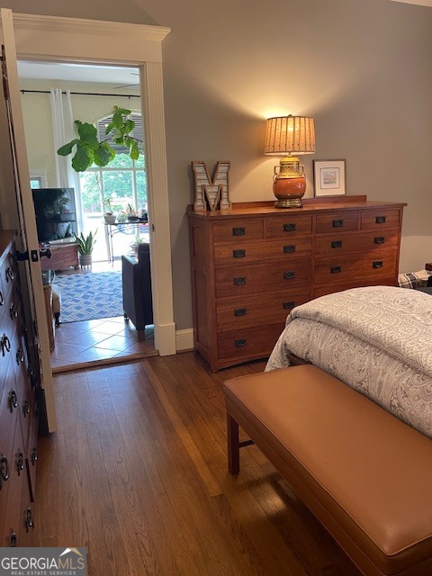 311 3rd Street Manchester, GA 31816 - Photo 13 of 61 a bedroom with a bed and a flat tv screen on dresser