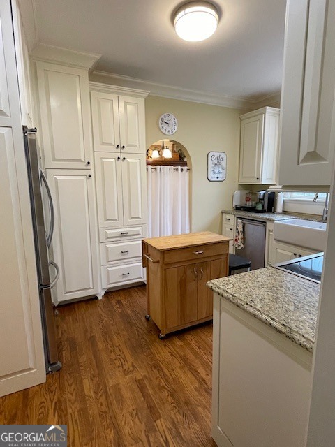 311 3rd Street Manchester, GA 31816 - Photo 25 of 61 a kitchen that has a sink a stove and a wooden floor