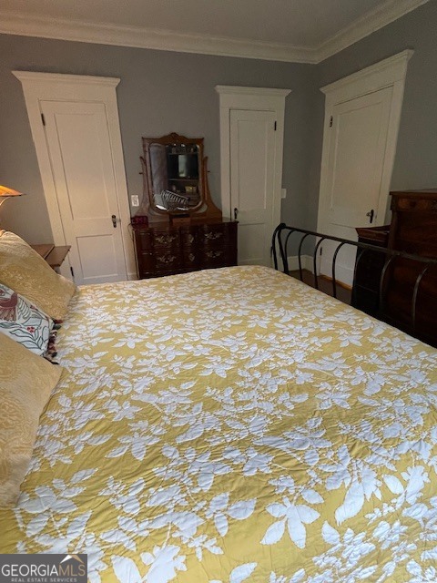 311 3rd Street Manchester, GA 31816 - Photo 35 of 61 a large bedroom with a bed and furniture