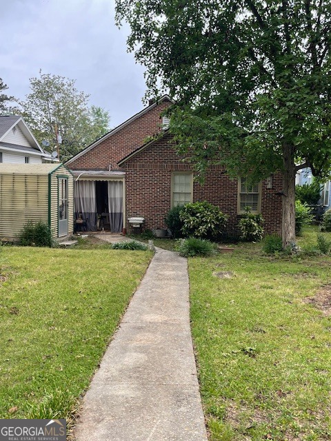 311 3rd Street Manchester, GA 31816 - Photo 59 of 61 a front view of house with yard and green space