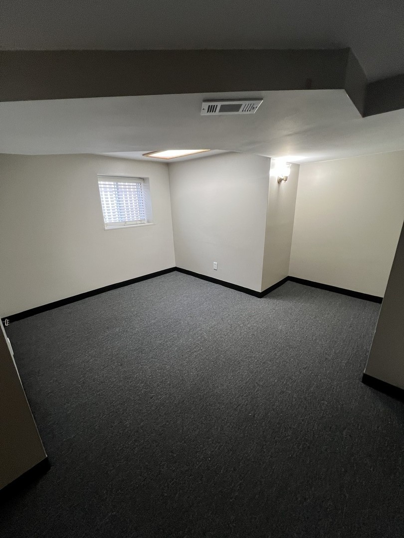 4818 North Moody Avenue, Unit G Chicago, IL 60630 - Photo 11 of 11 a view of an empty room with a window