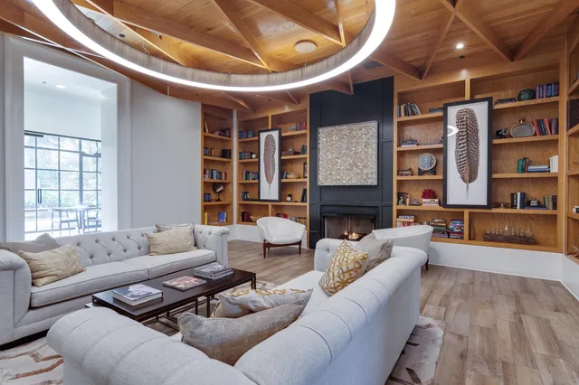 a kitchen with granite countertop a sink stainless steel appliances and cabinets