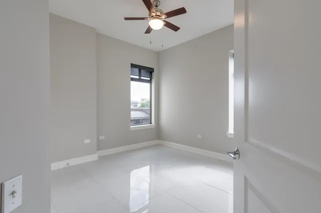 a white bath tub sitting next to a shower