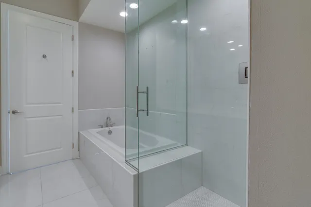 a room with gym equipment and floor to ceiling window