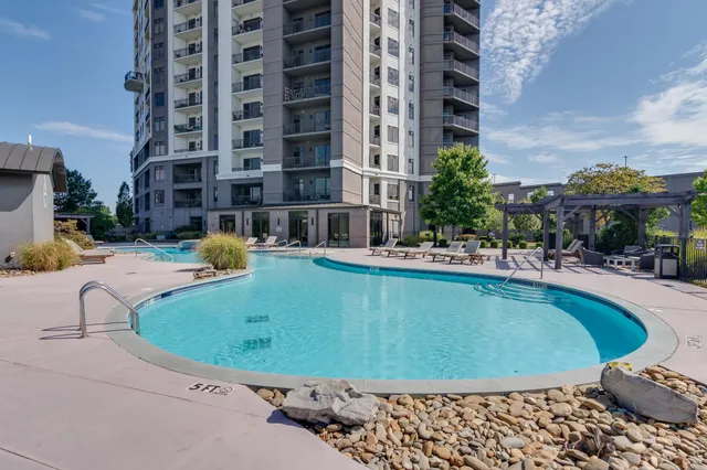 a view of a swimming pool with a patio