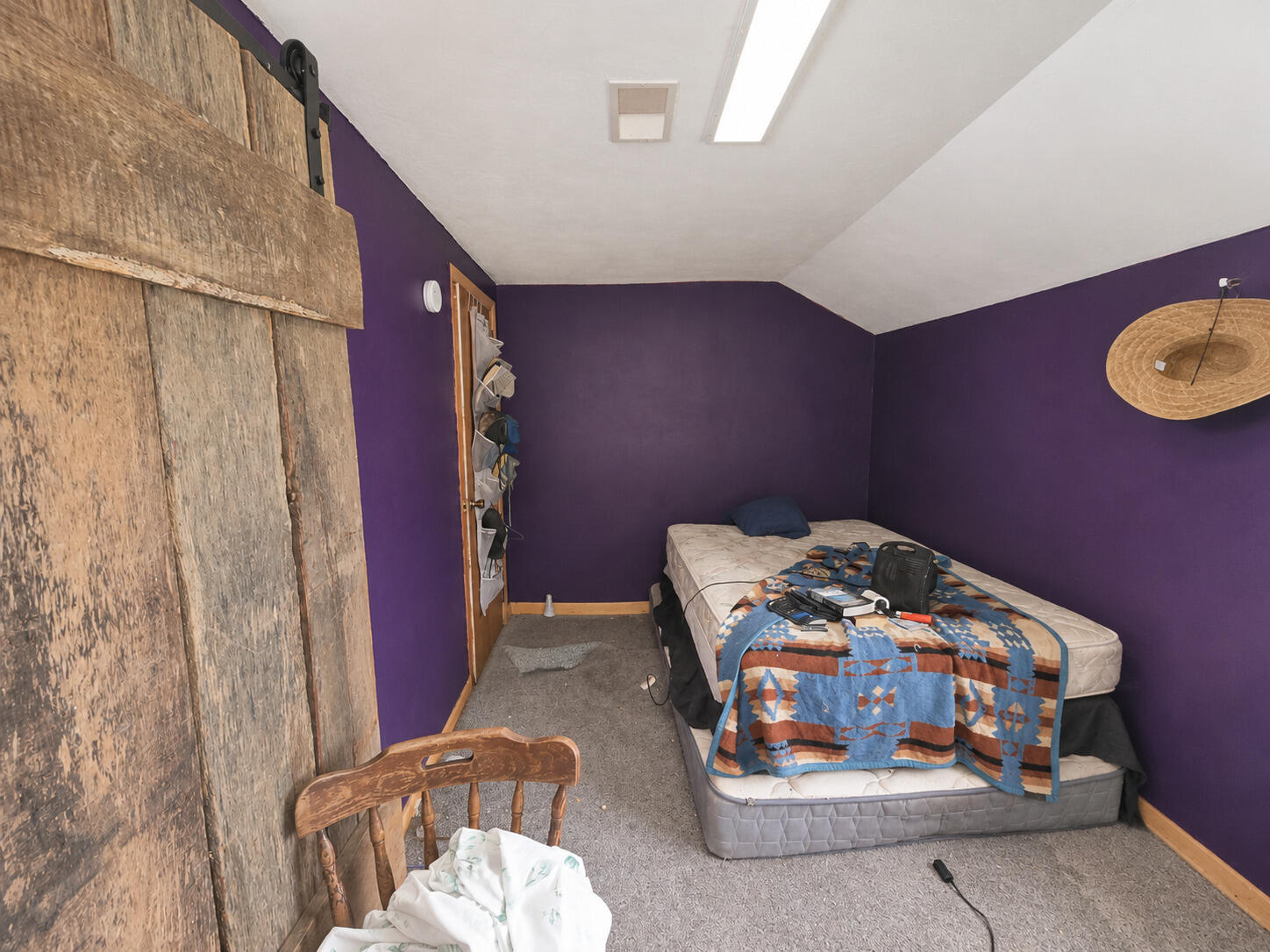 8545 Southeast Jeff Road Warren, IN 46792 - Photo 7 of 8 a bedroom with a bed and a mirror