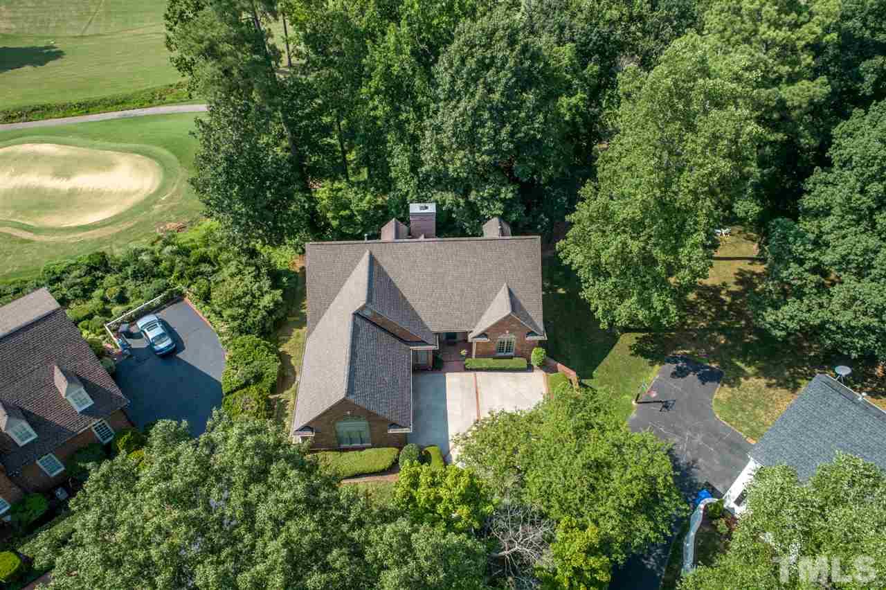 8912 Carnoustie Way Raleigh, NC 27613 - Photo 2 of 25 an aerial view of a house with swimming pool and garden