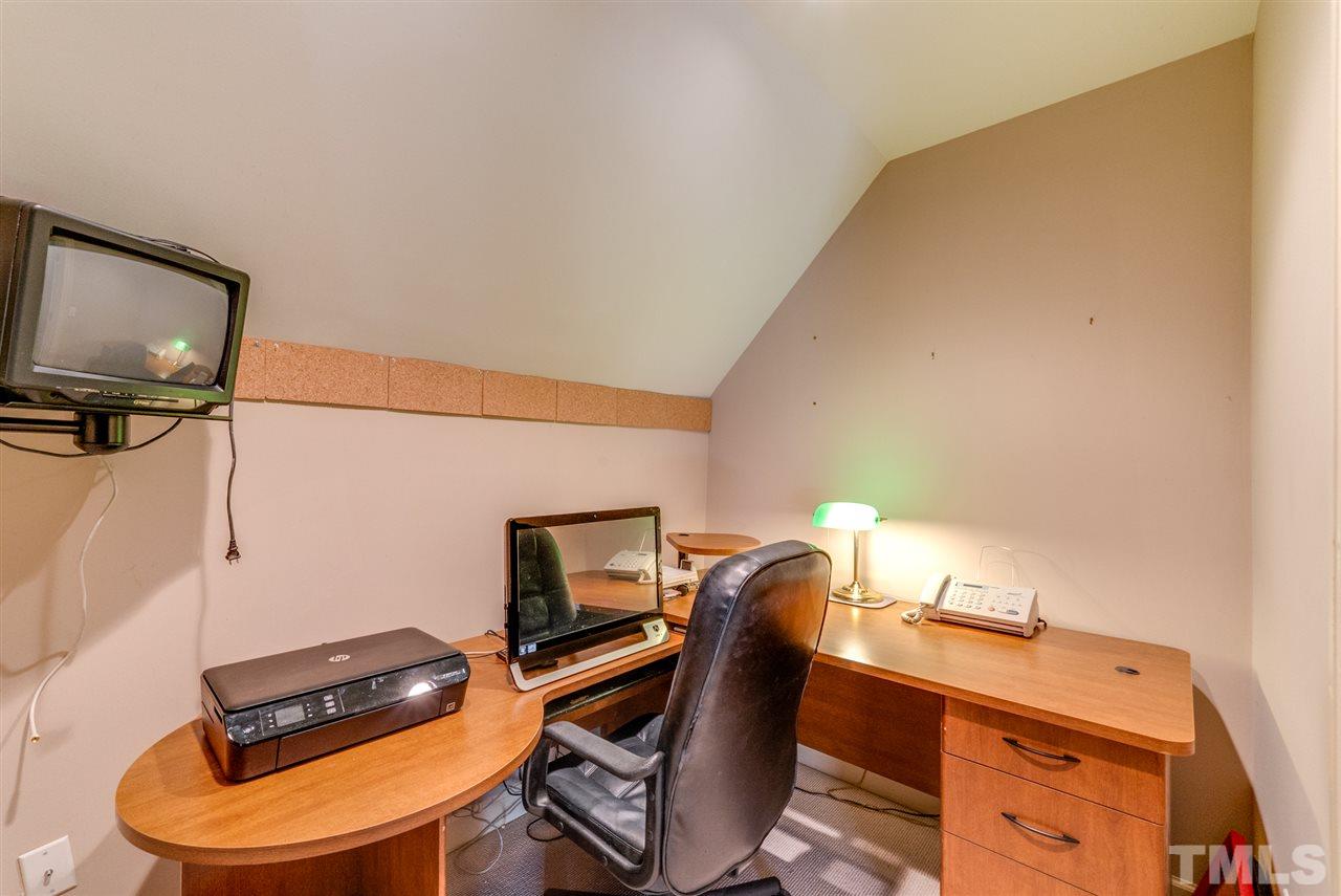 8912 Carnoustie Way Raleigh, NC 27613 - Photo 20 of 25 a view of a workspace with furniture