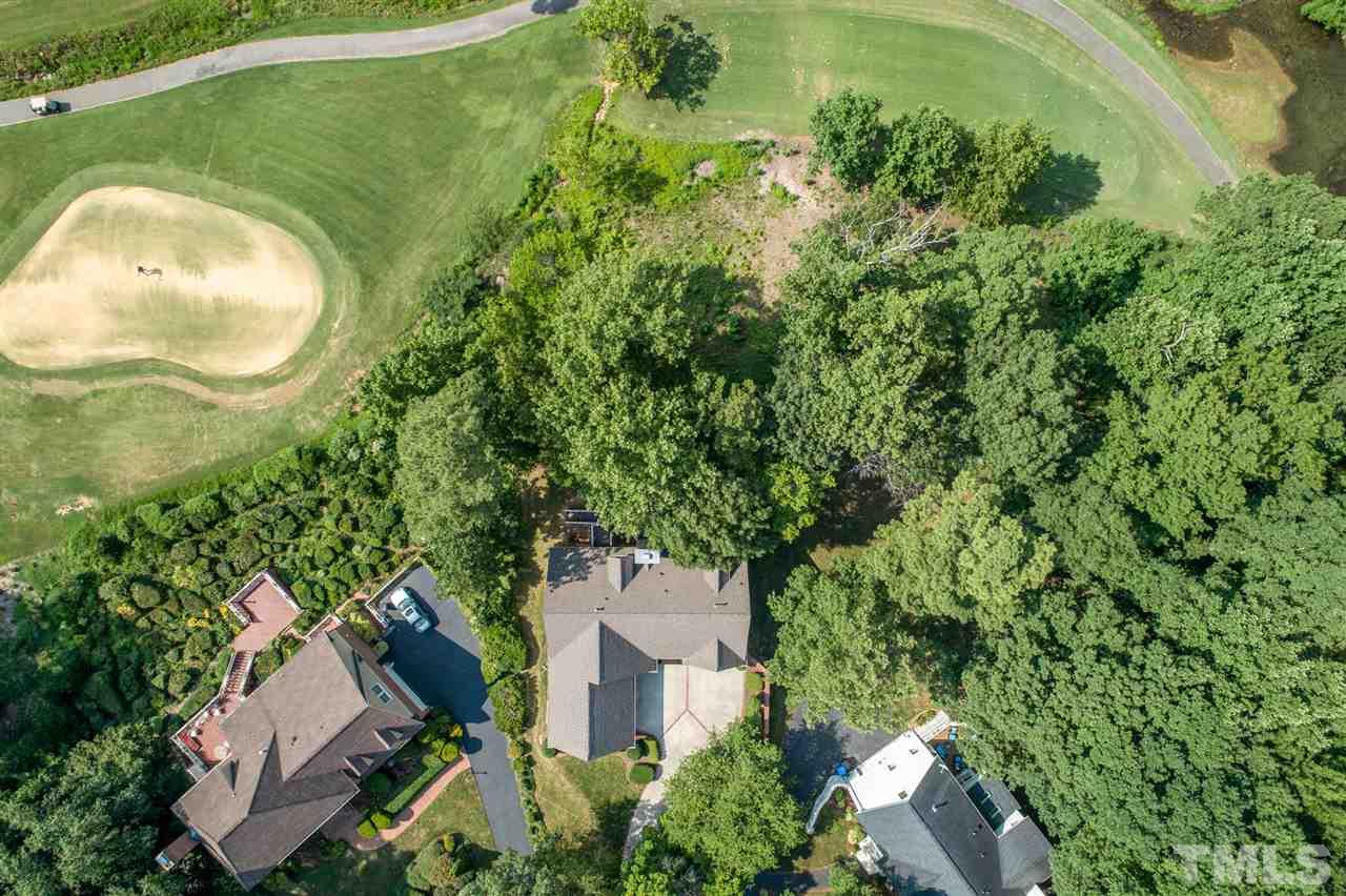 8912 Carnoustie Way Raleigh, NC 27613 - Photo 3 of 25 an aerial view of a house with a yard and swimming pool
