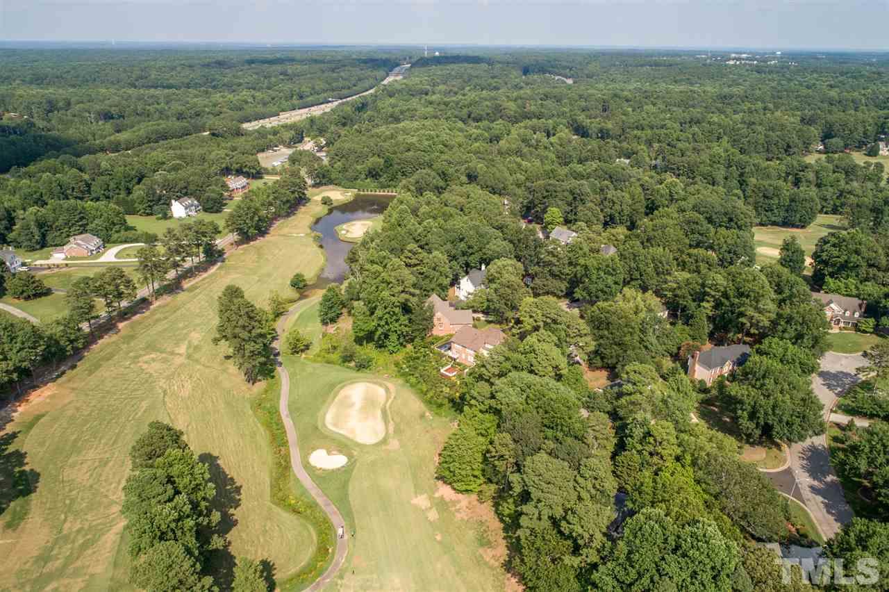 8912 Carnoustie Way Raleigh, NC 27613 - Photo 25 of 25 a view of a lake with a city