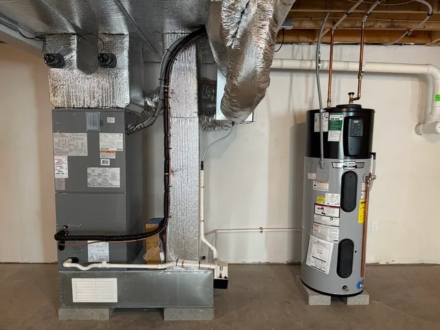 a view of empty room with chandelier fan