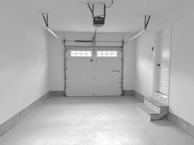 an empty room with a empty space and windows