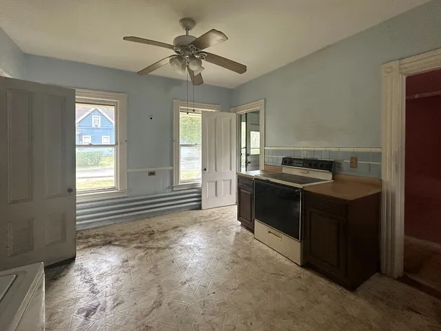 a kitchen with a stove and a cabinet