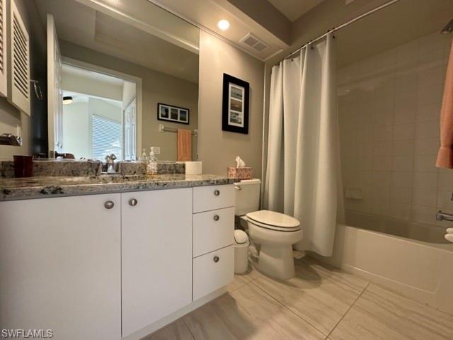 6800 Satinleaf Road South, Unit 202 Naples, FL 34109 - Photo 13 of 15 a bathroom with a toilet a sink and mirror