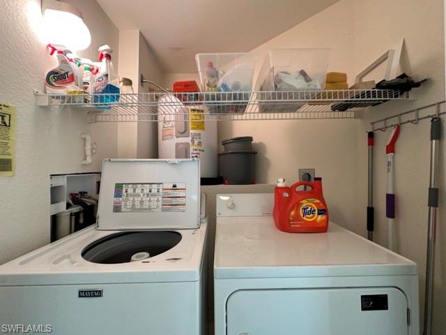 6800 Satinleaf Road South, Unit 202 Naples, FL 34109 - Photo 14 of 15 a kitchen with a stove and a refrigerator