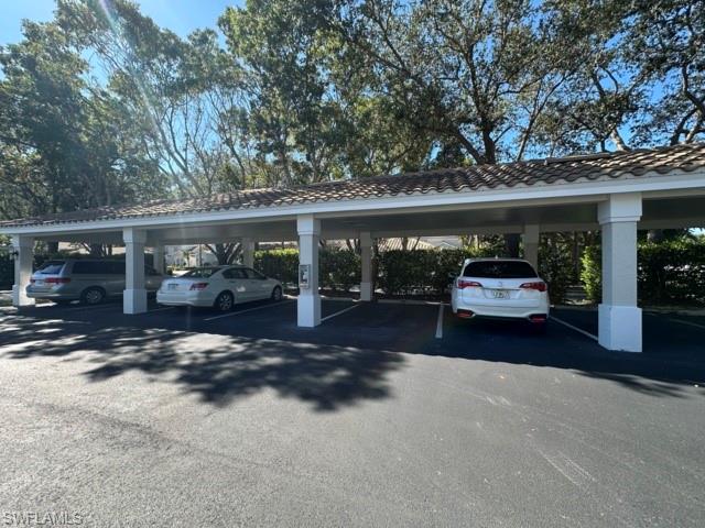 6800 Satinleaf Road South, Unit 202 Naples, FL 34109 - Photo 15 of 15 a view of a car parked in front of a building