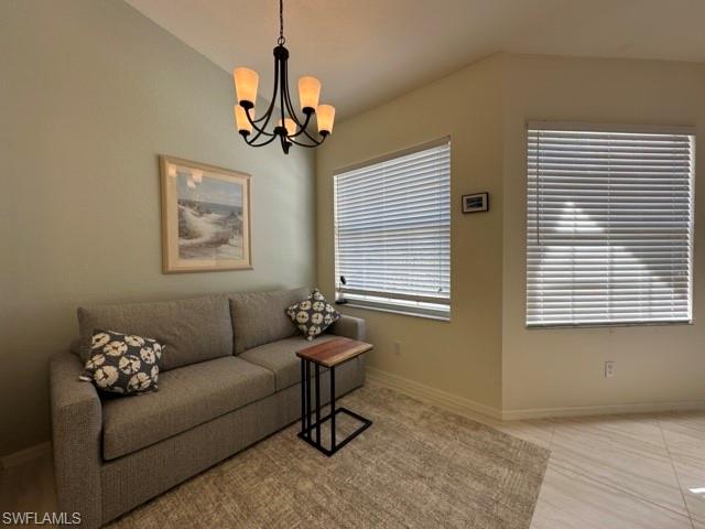6800 Satinleaf Road South, Unit 202 Naples, FL 34109 - Photo 7 of 15 a living room with furniture and a window