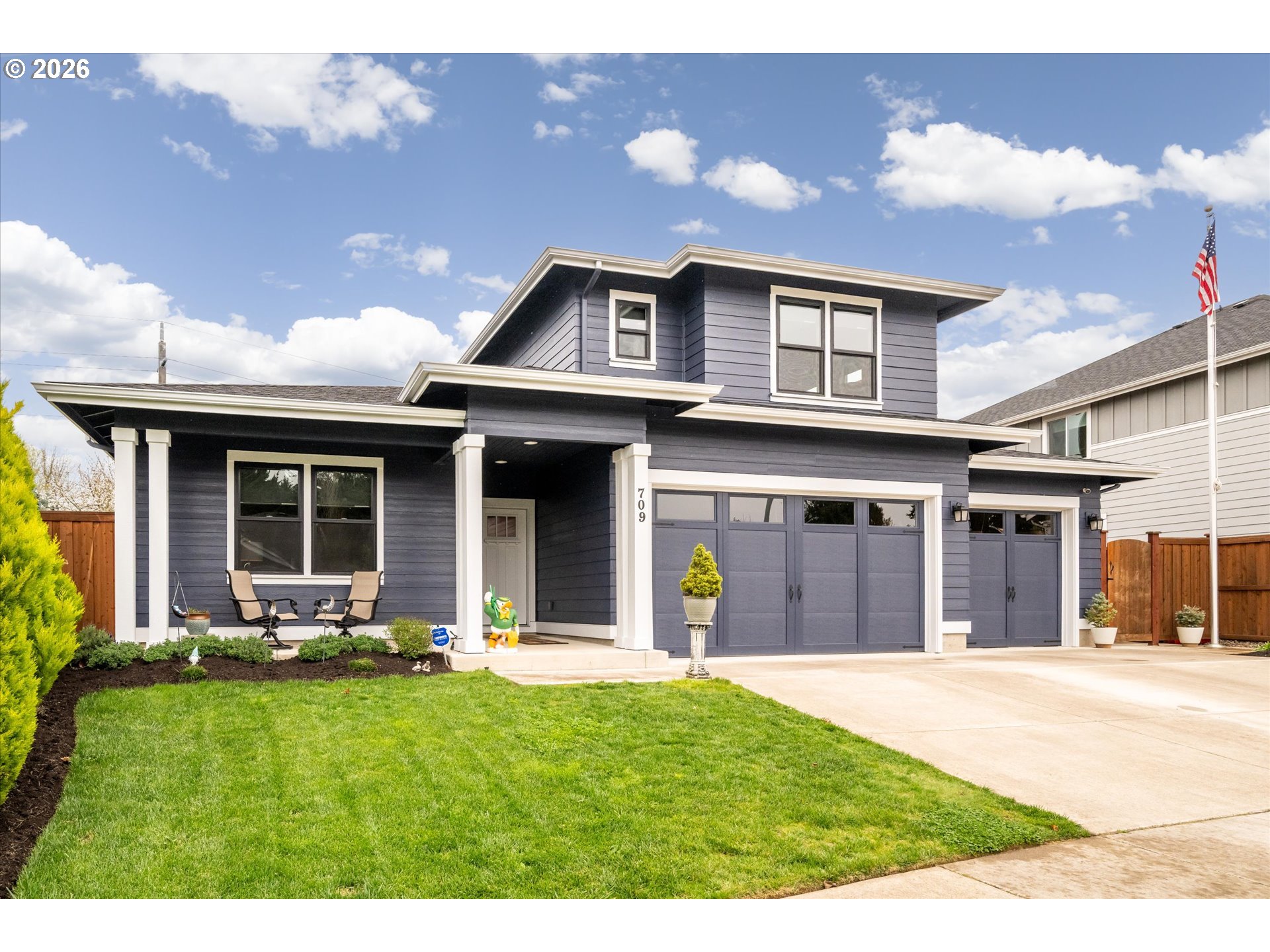 709 Tyson Lane Eugene, OR 97404 - Photo 1 of 31 a backyard of a house with yard and outdoor seating