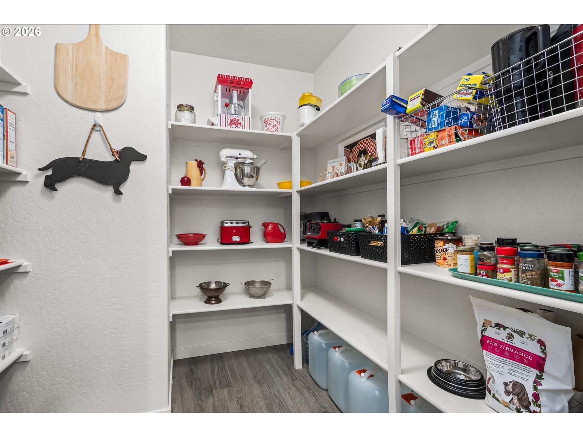 709 Tyson Lane Eugene, OR 97404 - Photo 11 of 31 a utility room with lots of clutter and refrigerator