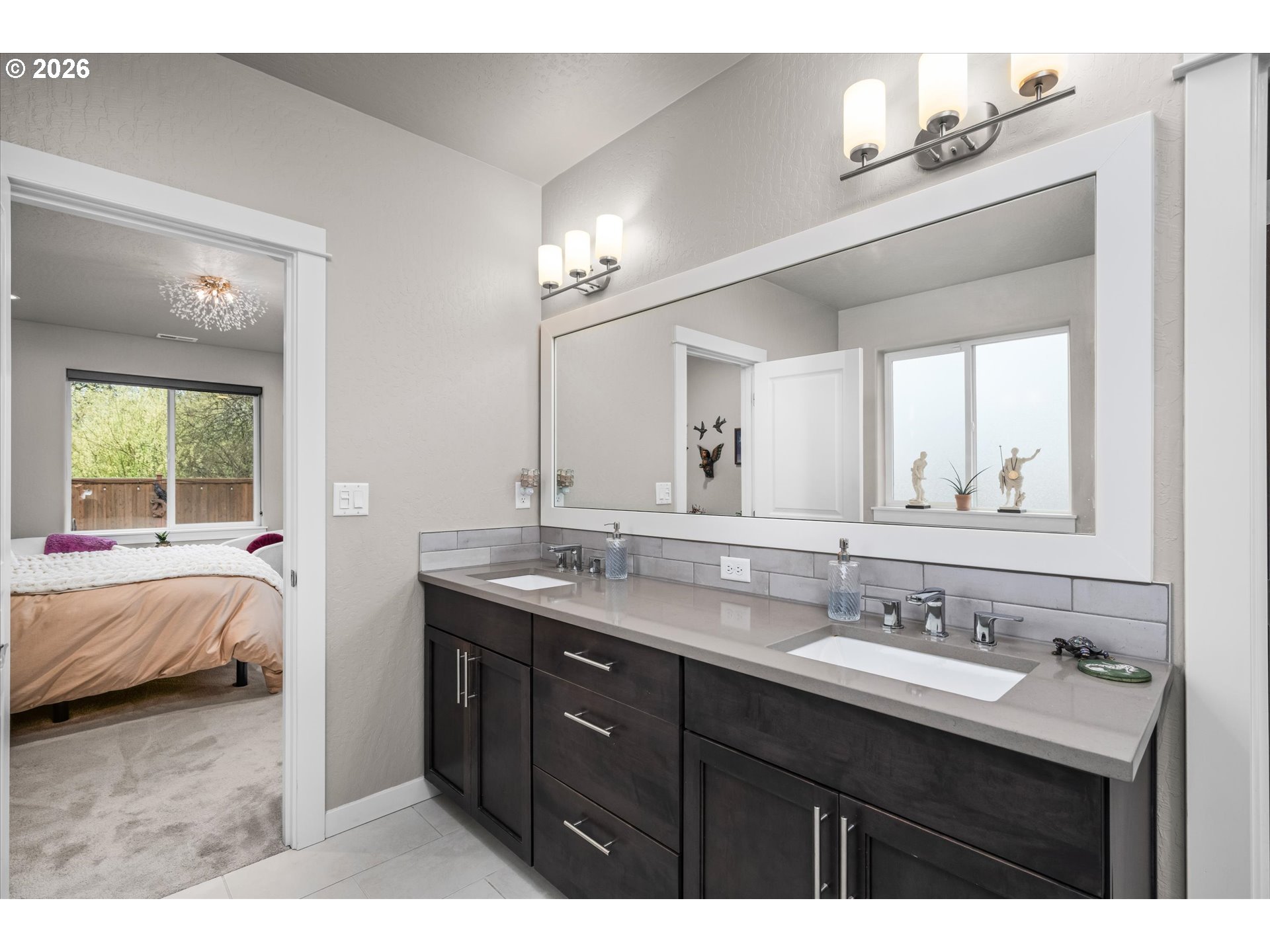 709 Tyson Lane Eugene, OR 97404 - Photo 13 of 31 a en suite bathroom with a sink double vanity and a mirror