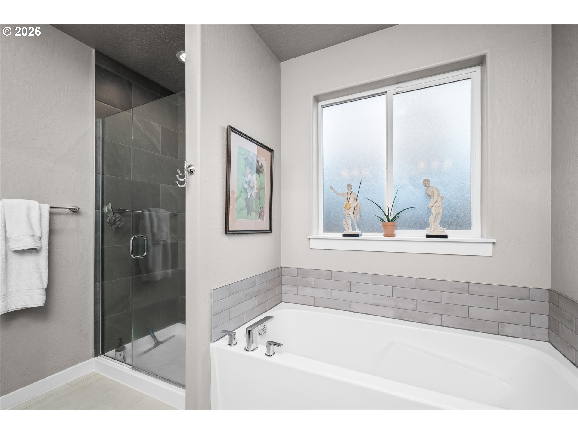 709 Tyson Lane Eugene, OR 97404 - Photo 14 of 31 a bathroom with a bathtub and a shower